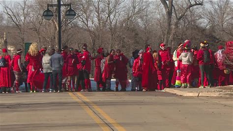 Red Dress Run takes over downtown Moline .